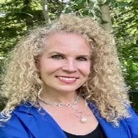 Patty Miller, President & Sr. HR/Business Advisor, MillerNet HR & Business Solutions Inc. seen with a bright smile on her face